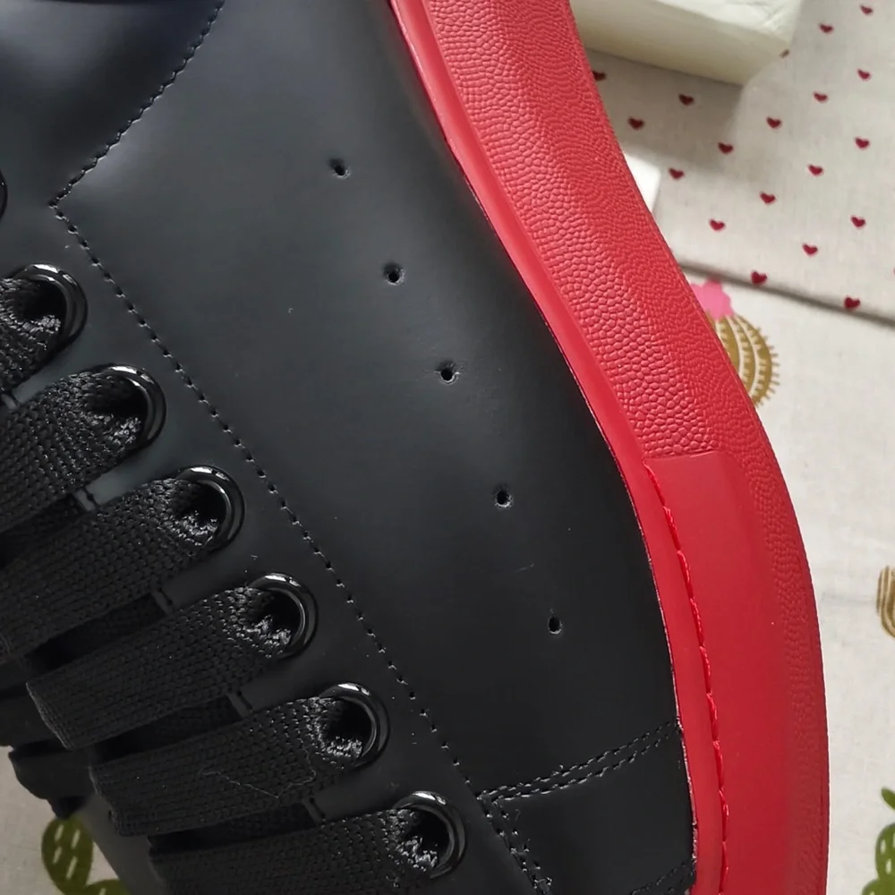 Alexander McQueen Black Leather Sneakers with Red Soles